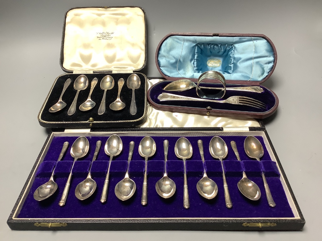 A cased Victorian silver christening trio, Martin, Hall & Co, Sheffield & London, 1879 and two other cased sets of silver teaspoons (6 & 12).